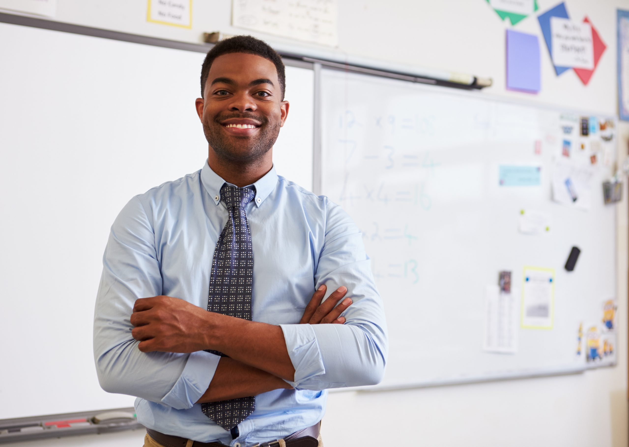 Portrait of confident African American male teacher in class